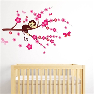 printet wallstickers Sovende abe på en gren i pinke nuancer