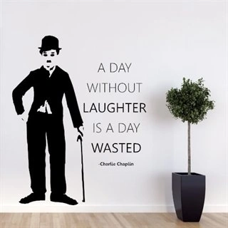 Wallstickers med tekst a day without laughter